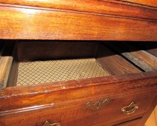 Offered at $7000. Oak six drawer plus two door North Wales dresser base. Superb example of the classic late 18th century North Wales cupboard dresser base, circa 1790. Excellent top with banded edges. Two rows of four drawers, three top drawers, plus two cupboard doors in the center with attractive shaped panels. Excellent color and condition, cleaned and waxed. (22"d x 76.75"l x 31"h) ~ Please send inquiries via text to 251.525.0966 and reference the photo number.