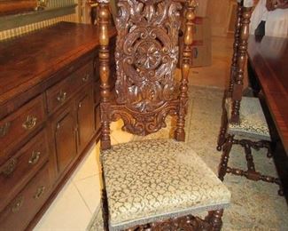 Offered at $3000. French Continental 1870 set of two head of table chairs with 1800s needle point upholstery and four side chairs. Made of hand carved Walnut. Side chair shown here. (17"d x 19"w x 51.75"h) ~ Please send inquiries via text to 251.525.0966 and reference the photo number.