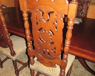 Offered at $3000. French Continental 1870 set of two head of table chairs with 1800s needle point upholstery and four side chairs. Made of hand carved Walnut. Side chair shown here. (17"d x 19"w x 51.75"h) ~ Please send inquiries via text to 251.525.0966 and reference the photo number.