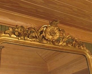 Offered at $4000. A beautiful and elegant early French 19th century carved wood mirror. Approx. 1840. Some repairable gesso issues. (52"w x 71"h) ~ Please send inquiries via text to 251.525.0966 and reference the photo number.