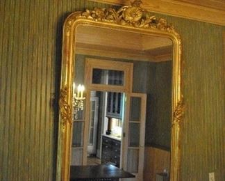 Offered at $4000. A beautiful and elegant early French 19th century carved wood mirror. Approx. 1840. Some repairable gesso issues. (52"w x 71"h) ~ Please send inquiries via text to 251.525.0966 and reference the photo number.