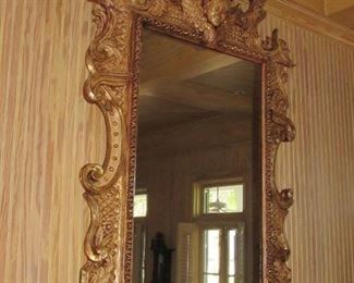 Offered at $6900.  French gilt carved wood mirror with cherub and "winds of time" carvings. Approx. 1790 era. Some slight cracking expected with age of piece, and easily repairable. (84" x 52") ~ Please send inquiries via text to 251.525.0966 and reference the photo number. 