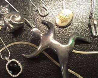 Sterling pendants, chains & lrg modern crawling man brooch 