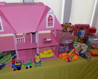 more toys....Barbie dolls and clothes...doll house