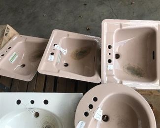 Mocha and white sinks in cast iron, porcelain, and ceramic