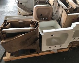 Many many vintage American Standard porcelain china sinks in white, beige, blue, and more