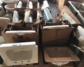 Many many vintage American Standard porcelain china sinks in white, beige, blue, and more