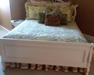 White, wood queen bed, custom-made bedding and pillows