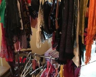 Huge assortment of scarves and purses including coach.
