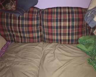 Pic showing two cushions of couch.  Has three back cushions together.  Long couch (at least 6 feet).   Couch is plaid,  but tan cover included.   Make offer.