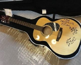 acoustic guitar signed by Kool and the Gang