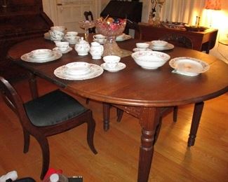 walnut extension table with 2 leaves , punch bowl & china