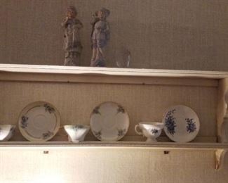 Cups and saucers, wall shelf