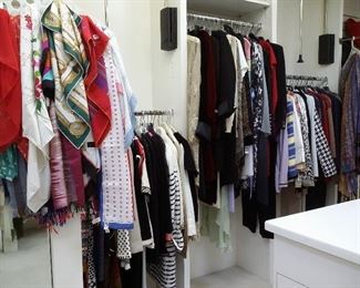 A closet full of beautiful clothes.