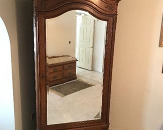 Stunning 7’ mirrored antique armoire