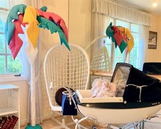 Hanging Basket Chair Shaded by Cloth Palm Tree;