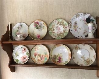 Look at these beautiful plates and wood shelf.
