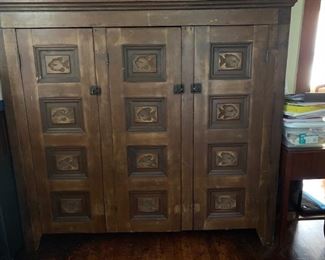 Fishing cabinet with carved fishes 67”W x 63”H x 15”D