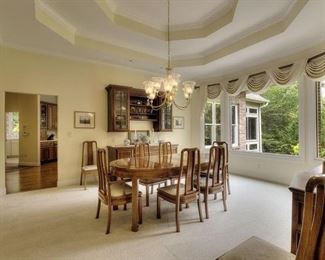 Dining room has beautiful buffets, table and six chairs.