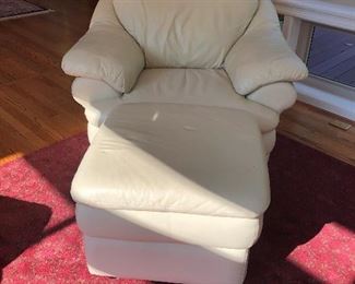 White leather chair and ottoman.