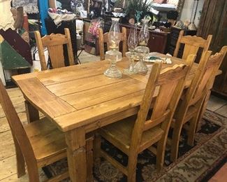 Wonderful rustic pine dining table and six chairs has Colorado charm all over it