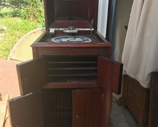 Victrola with records. Excellent condition. No damage. Very sturdy and solid 