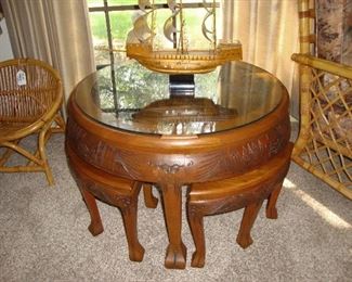 SPLENDID WOOD CARVED TEA TABLE WITH NESTING STOOLS (SEE NEXT PHOTO)