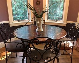 Hammered copper and iron dining table 