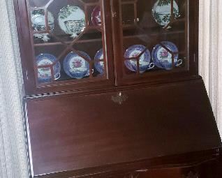 Chippendale style Slant front desk with glass door top.