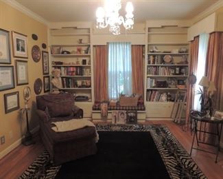 books , collectible, lots of pictures from  Sheriff Best   time in the koisheriffs office, Clinton collectibles lounge chair and lots of rugs throughout the house