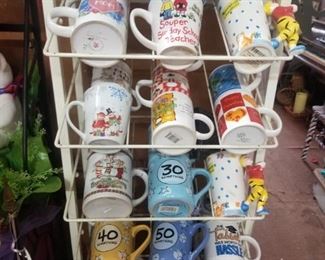 coffee mugs for all occasions, rack will be for sale and can be removed on Saturday
