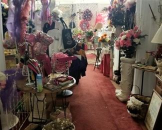 metal archways, wreaths, clothing, live plants, small tables and chairs