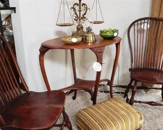 Antique Windsor chairs and carved lion's head entry table