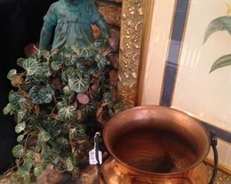 Girl accent statue; one of several copper vessels