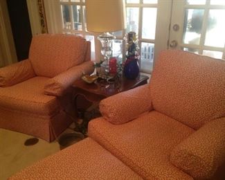 Two matching occasional chairs with one matching ottoman