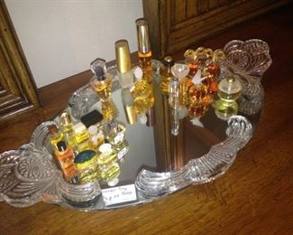 Miniature perfume bottles on mirrored vanity tray