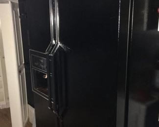 Black Whirlpool refrigerator/freezer
