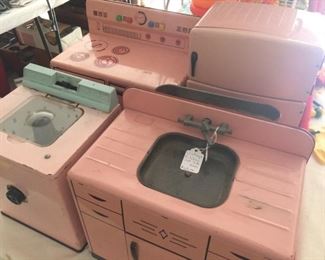 Precious-in-pink-vintage toy stove, refrigerator, washing machine, and sink