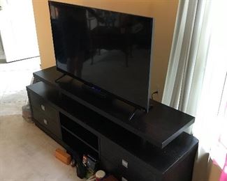 Visio flat screen smart TV on TV stand