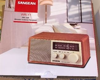 New, in box.  Sangean AM/AM Wooden cabinet receiver table Radio