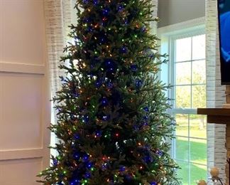 12' Tall Prelit Christmas tree - Lights can be changed from colored lights to white lights   - the tree was only used 1-year 
