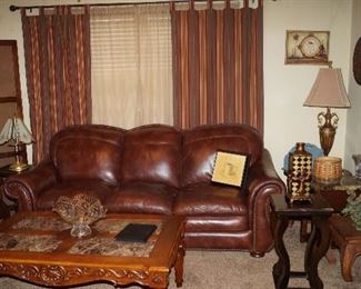 couch, coffee table, large photo screen, room divider, lamps, pottery, decor