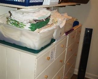 doilies, linens, 2 small chest of drawers