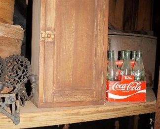 small cabinet, coke bottles