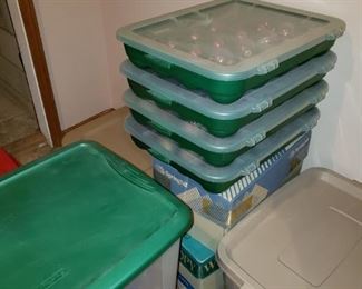 Ornament bins filled with Christmas ornaments.