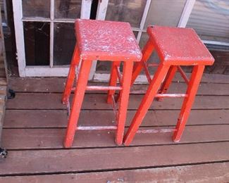 Two red wood stools