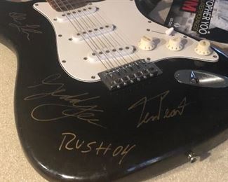 Guitar autographed by RUSH