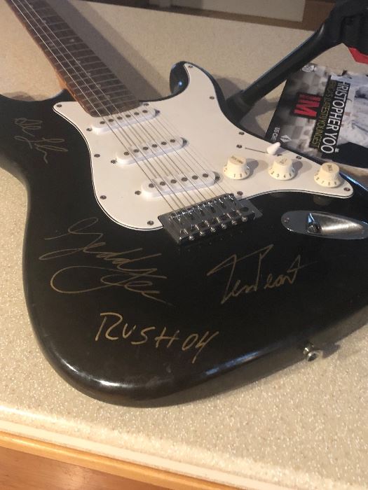 Guitar autographed by RUSH