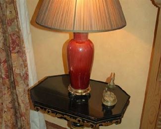 Sang de boeuf lamp on black lacquered table