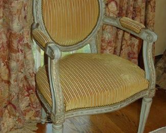 One of pair of open arm French-style chairs